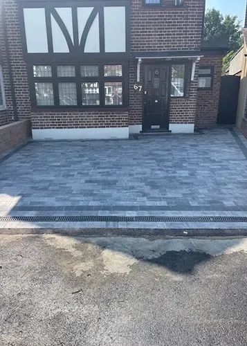 a house with a large driveway in front of it
