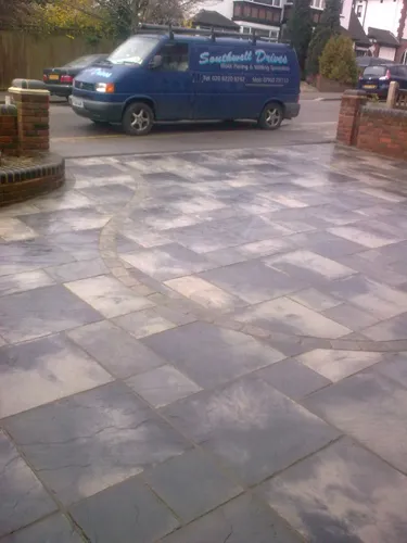 a blue van is parked on the side of the road