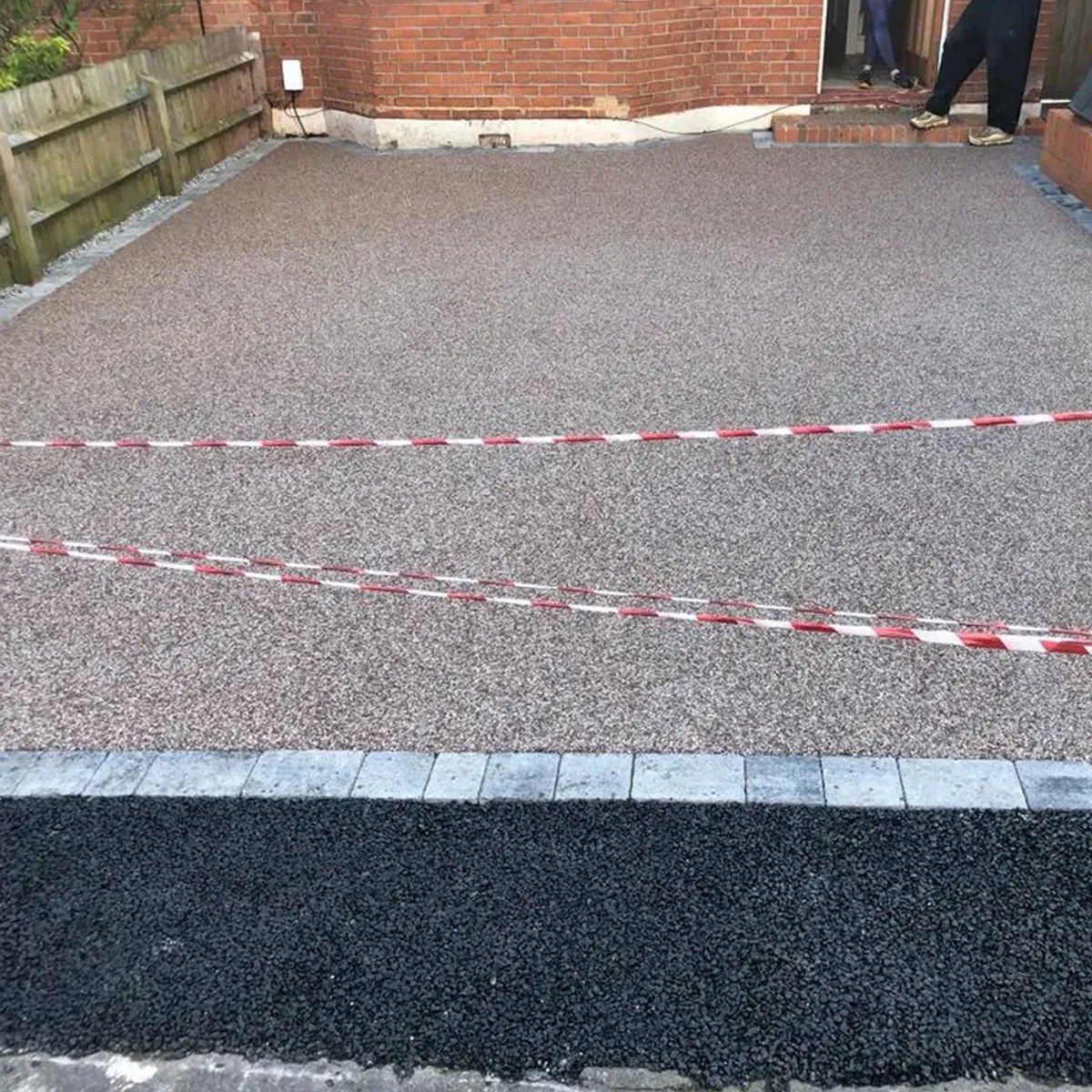 a man is standing on the side of a building